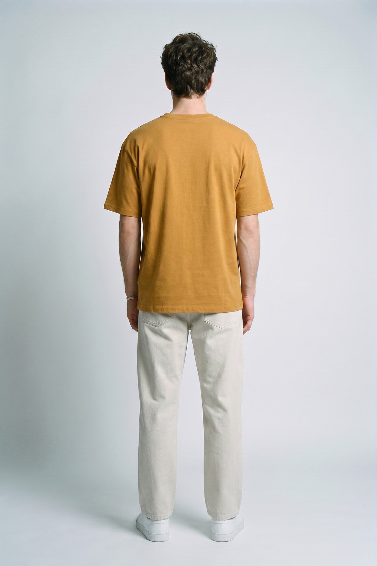 Camel male model back view — RARILETO Left Logo Classic Tee