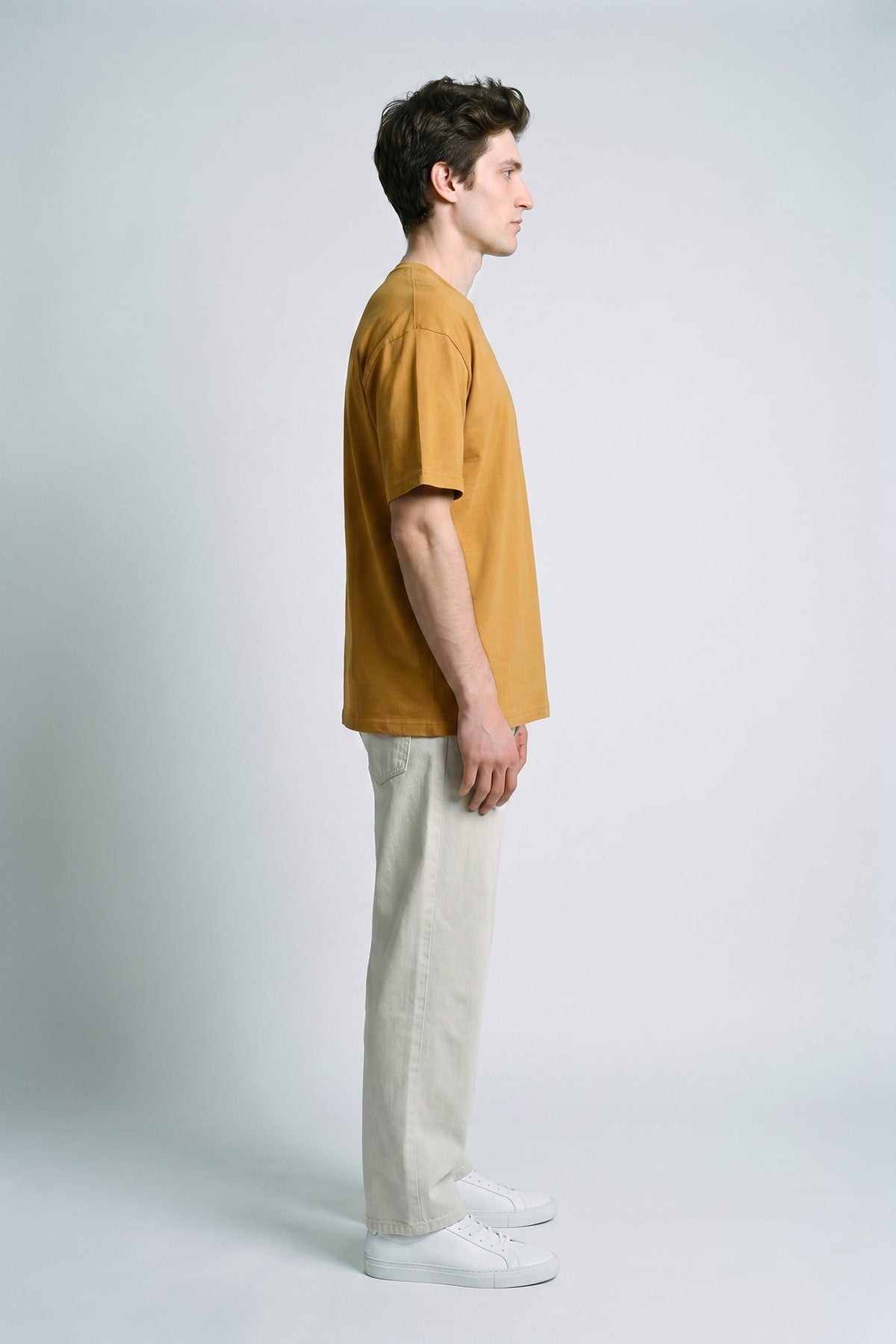 Camel male model side view — RARILETO Left Logo Classic Tee