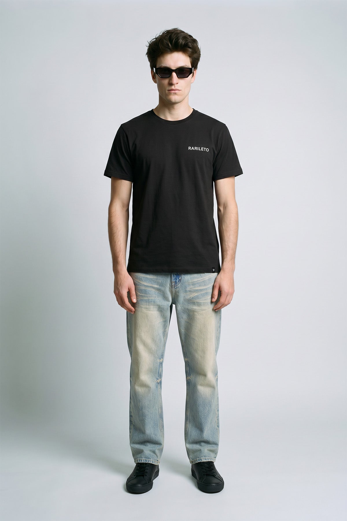 Black male model wearing front view — RARILETO Left Logo Classic Tee