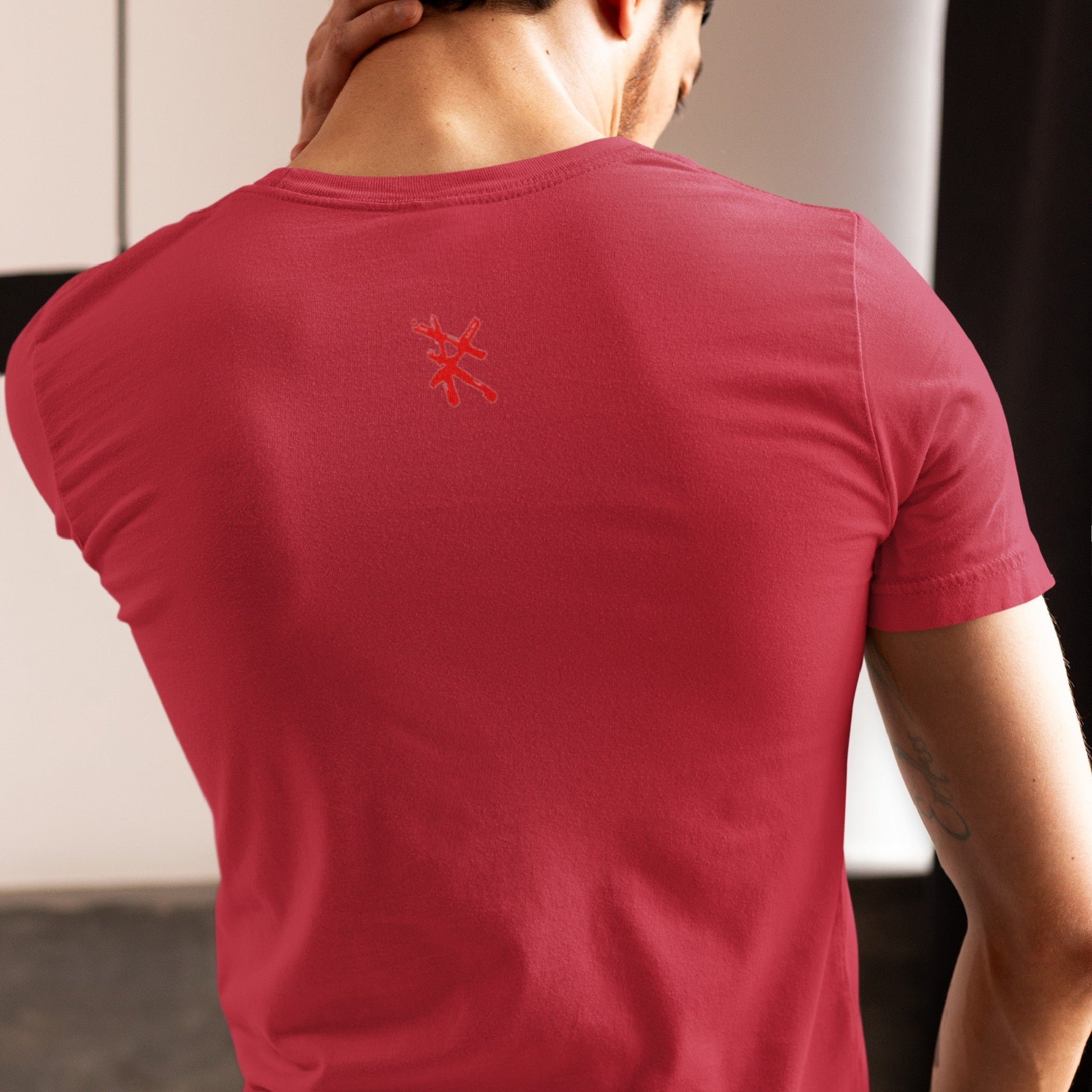 Back view on model wearing the Caveman Classic T-Shirt in red, perfect for casual streetwear. Rarileto.