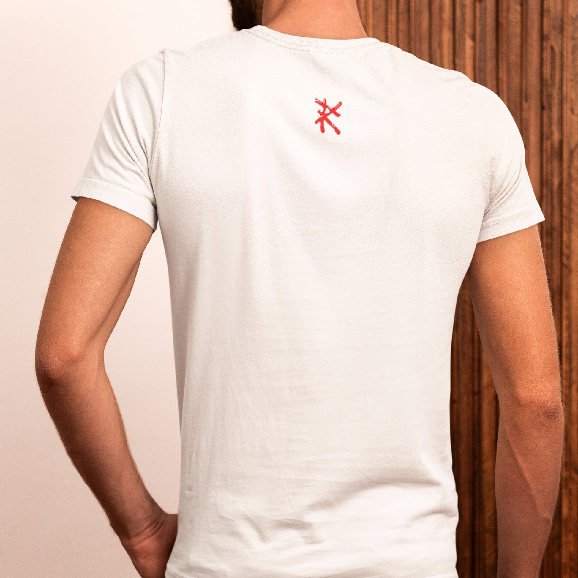 Back view on model wearing the Caveman Classic T-Shirt in white, great for everyday streetwear. Rarileto.