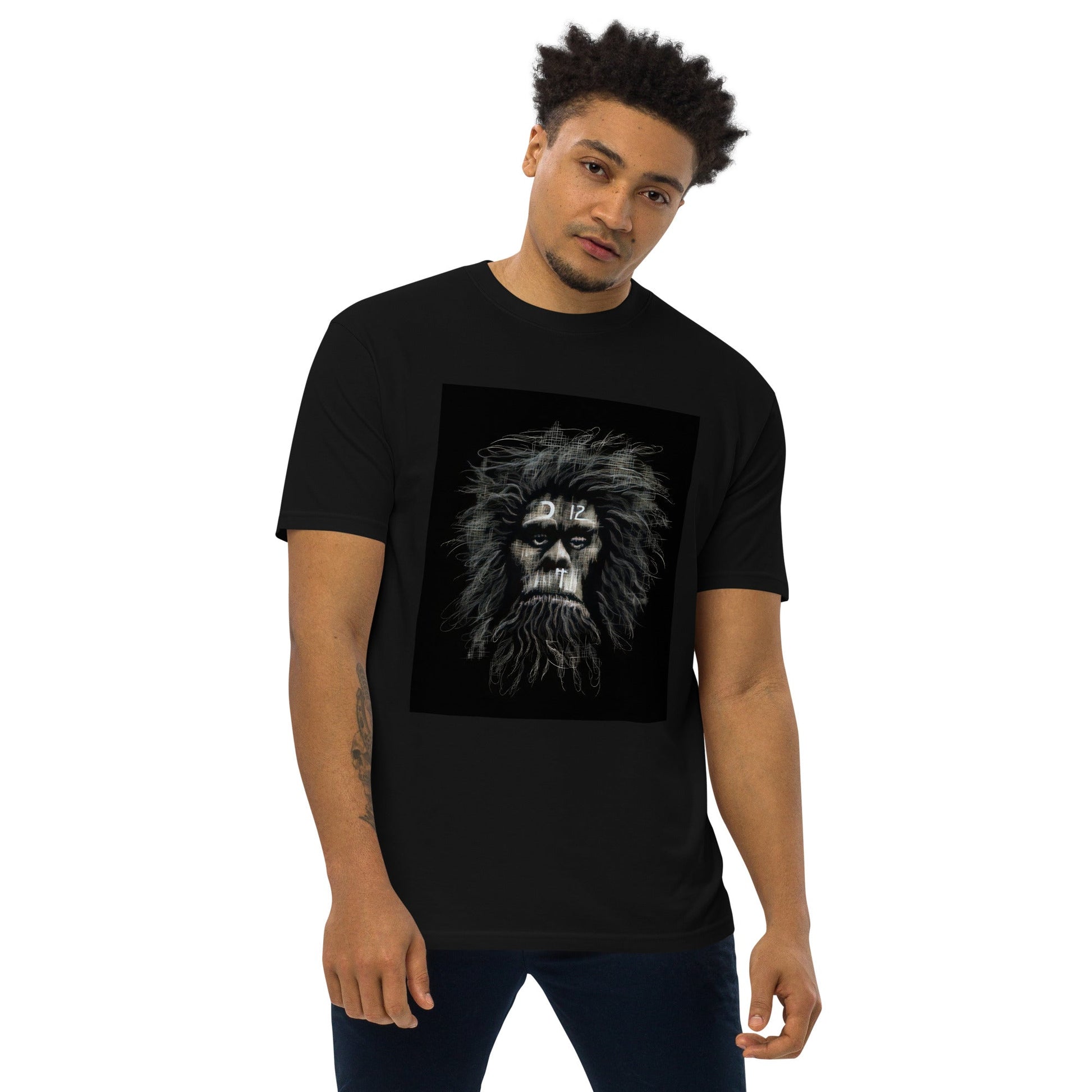 Black Front View of CAVEMAN PORTRAIT Premium Heavyweight T-Shirt on Model