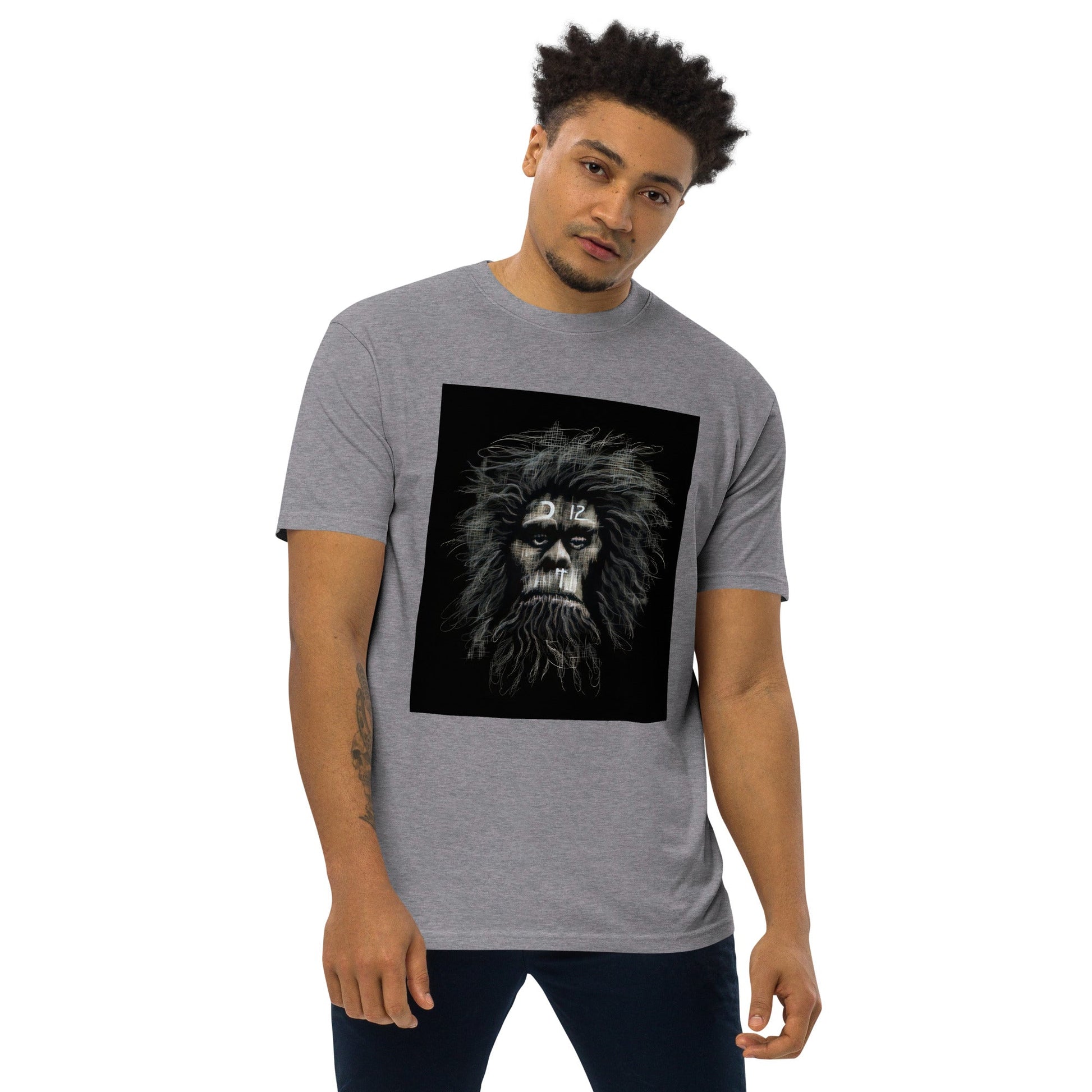 Carbon Grey Front View of CAVEMAN PORTRAIT Premium Heavyweight T-Shirt on Model