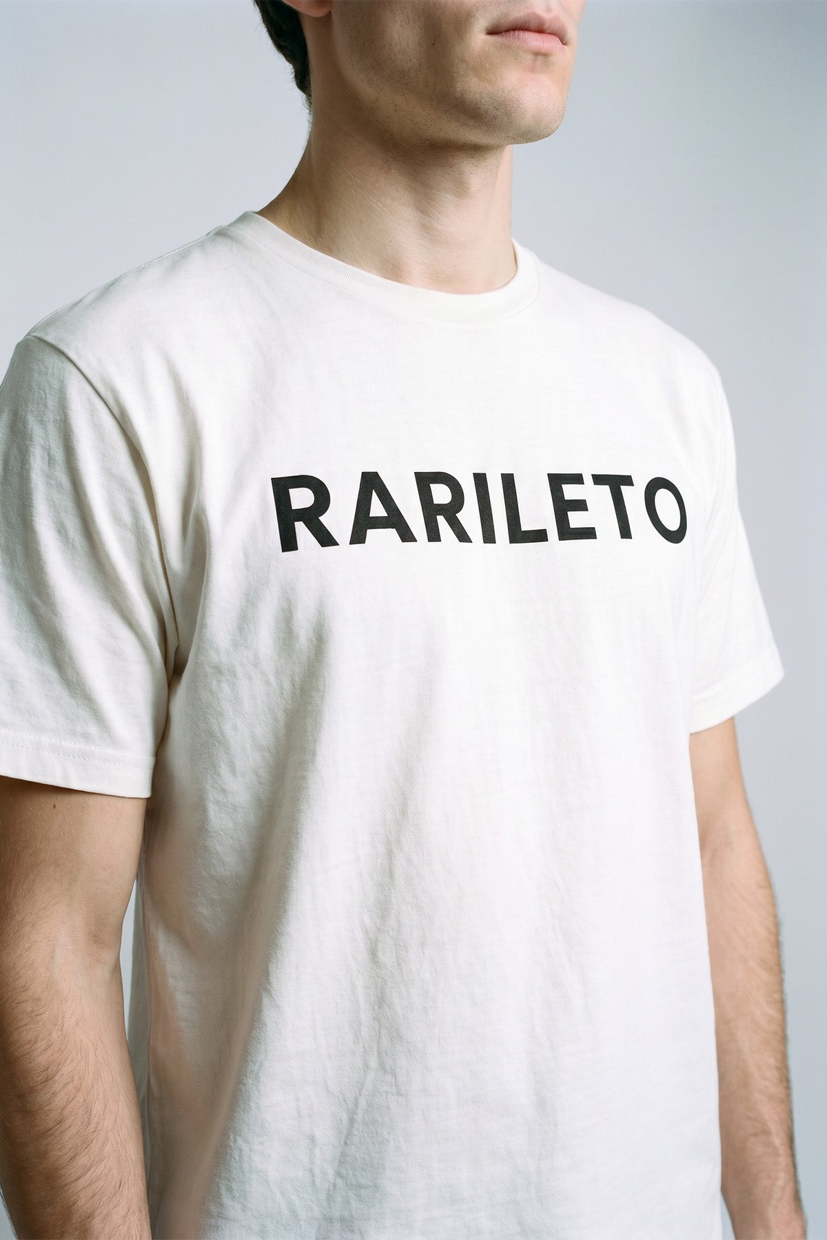 White close-up graphic print detail — RARILETO Logo Classic Tee