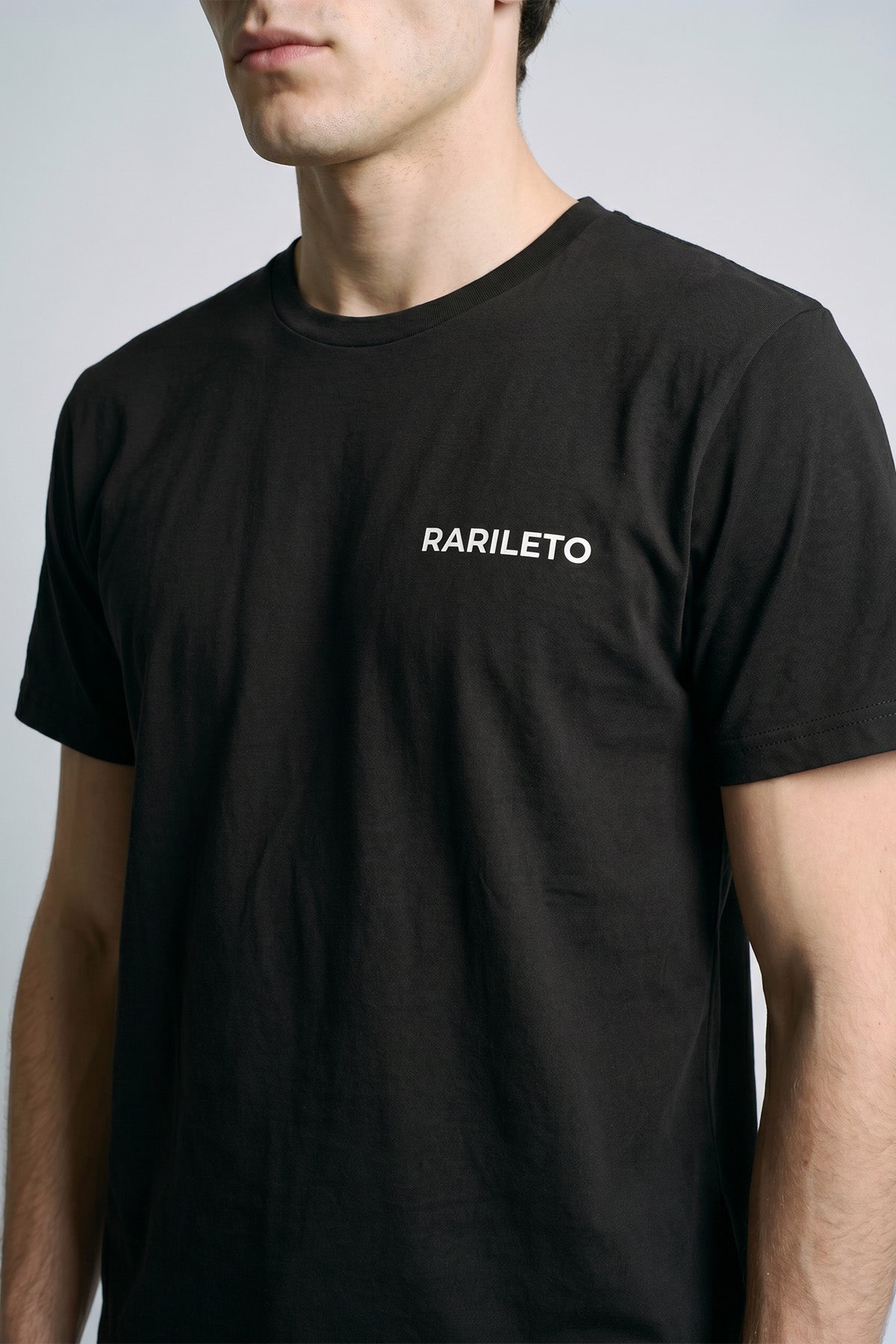 Black close-up graphic print detail — RARILETO Left Logo Classic Tee