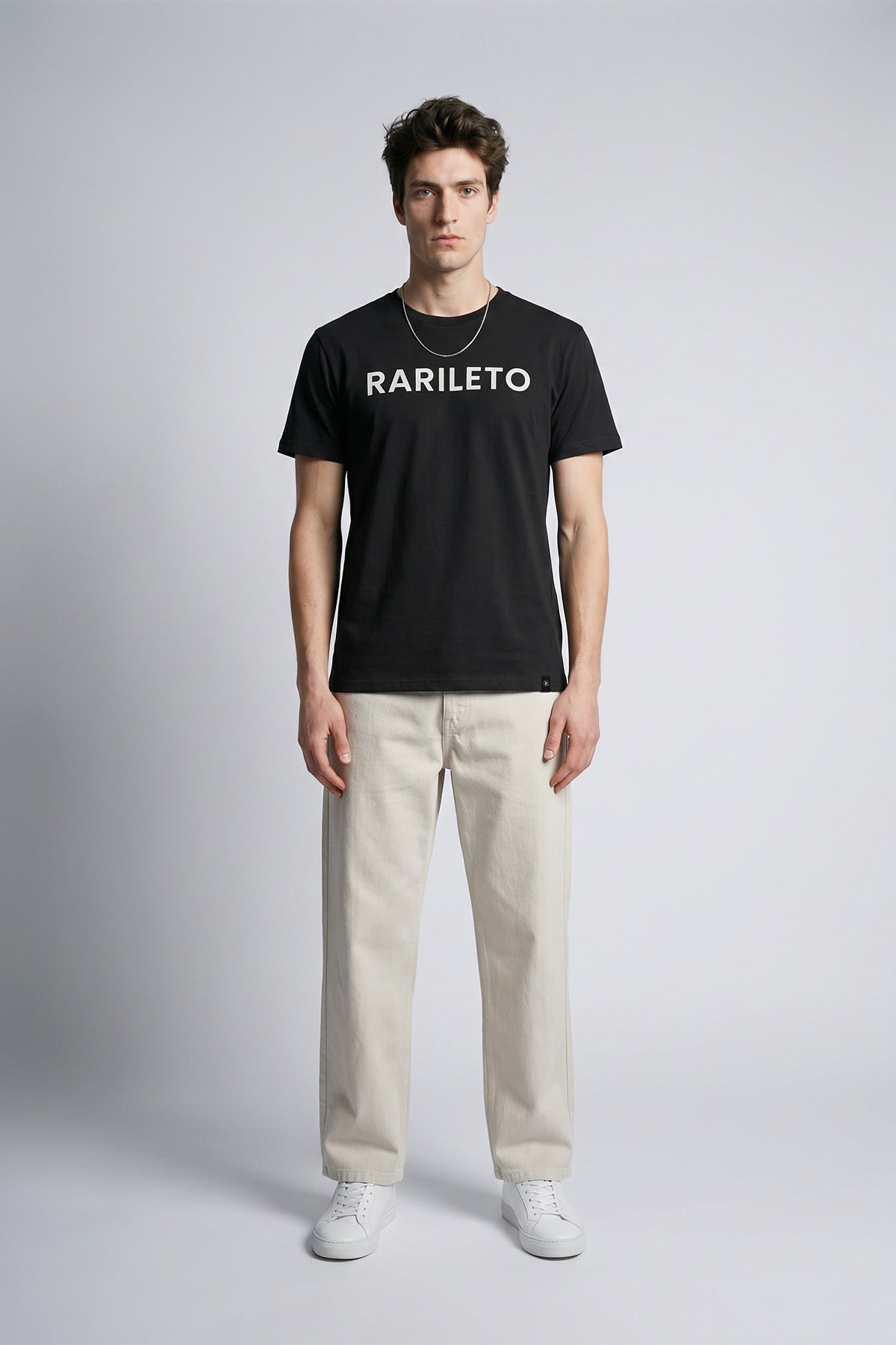 Black male model wearing front view — RARILETO Logo Classic Tee