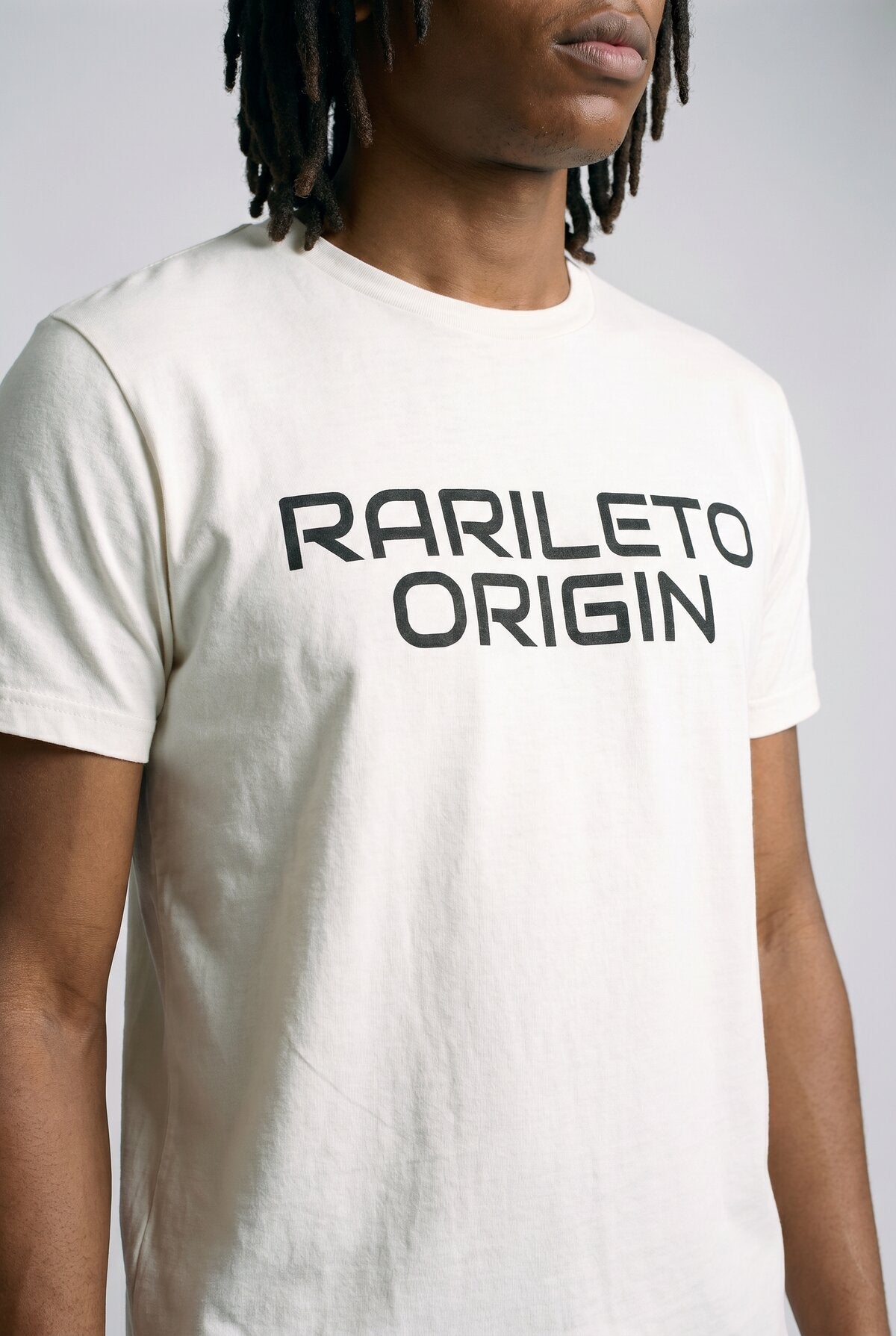 White close-up graphic print detail — RARILETO Origin Classic Tee