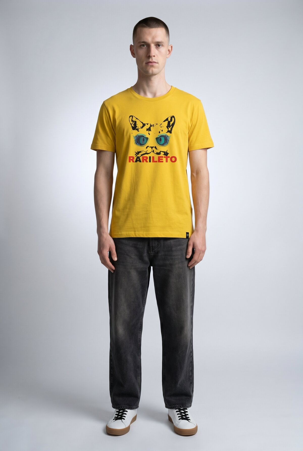 Yellow male model wearing front view — RARILETO Cat Eyes Classic Tee