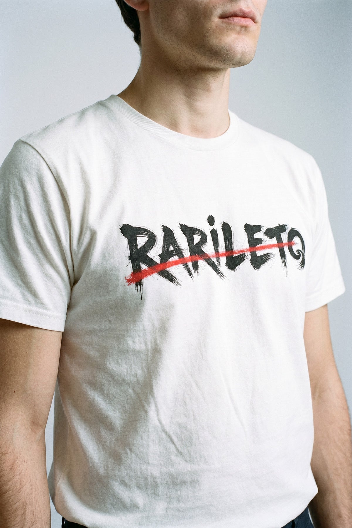 White close-up graphic print detail — RARILETO Brushed Stroke Logo Classic Tee