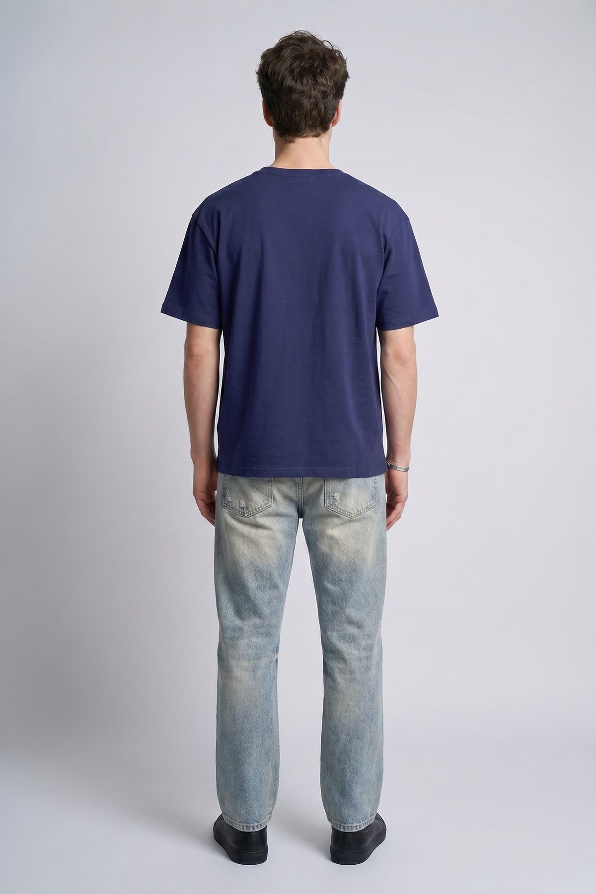Navy male model back view — RARILETO Left Logo Classic Tee