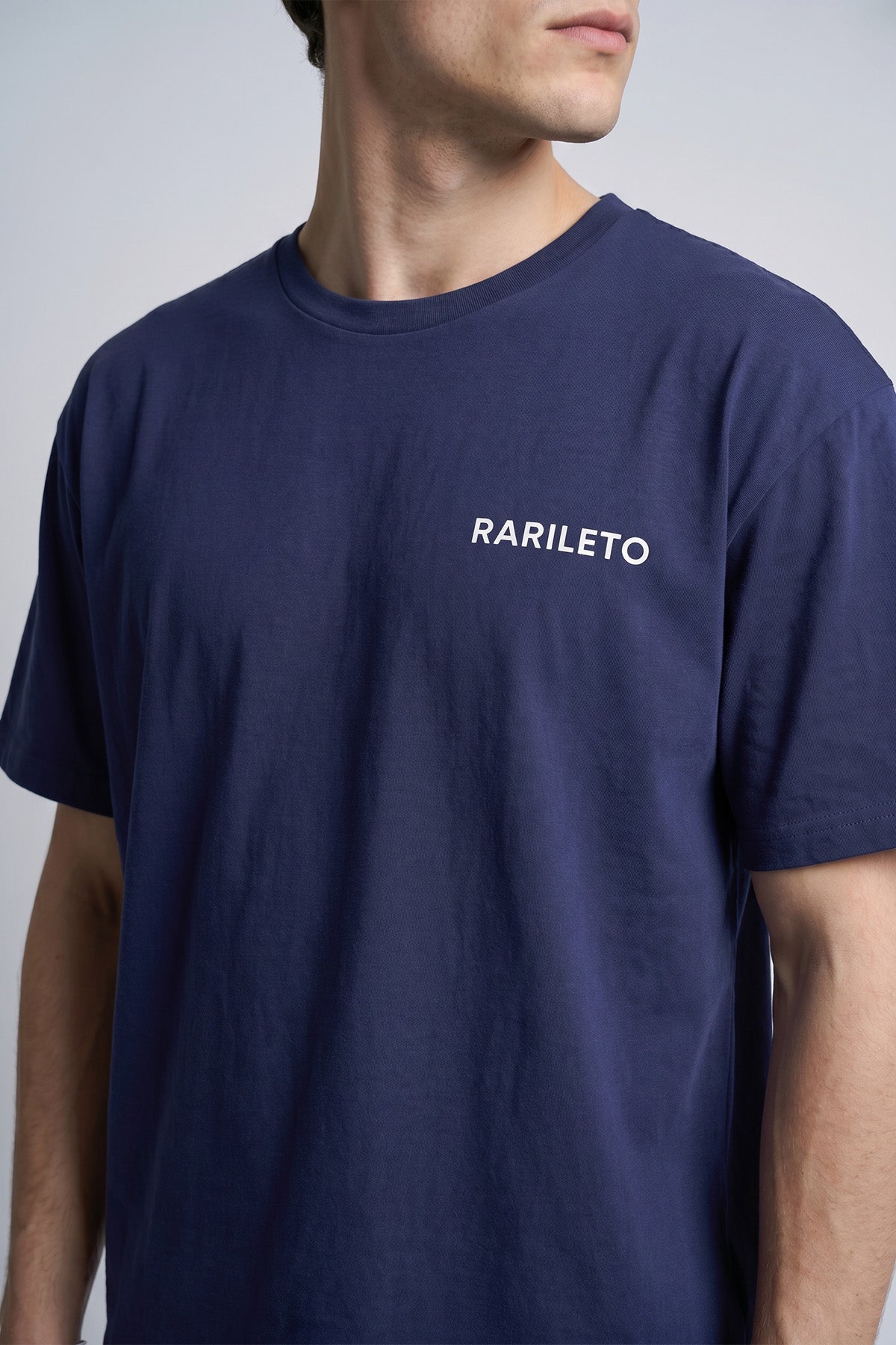 Navy close-up graphic print detail — RARILETO Left Logo Classic Tee