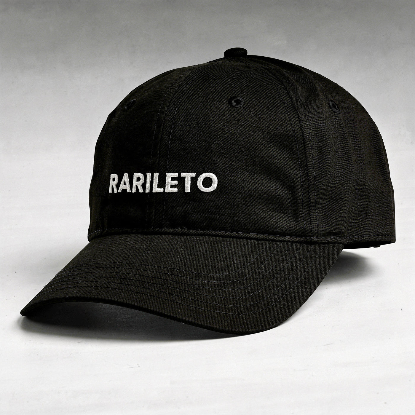 Black cap side view RARILETO Wordmark Cap — Unstructured Strapback