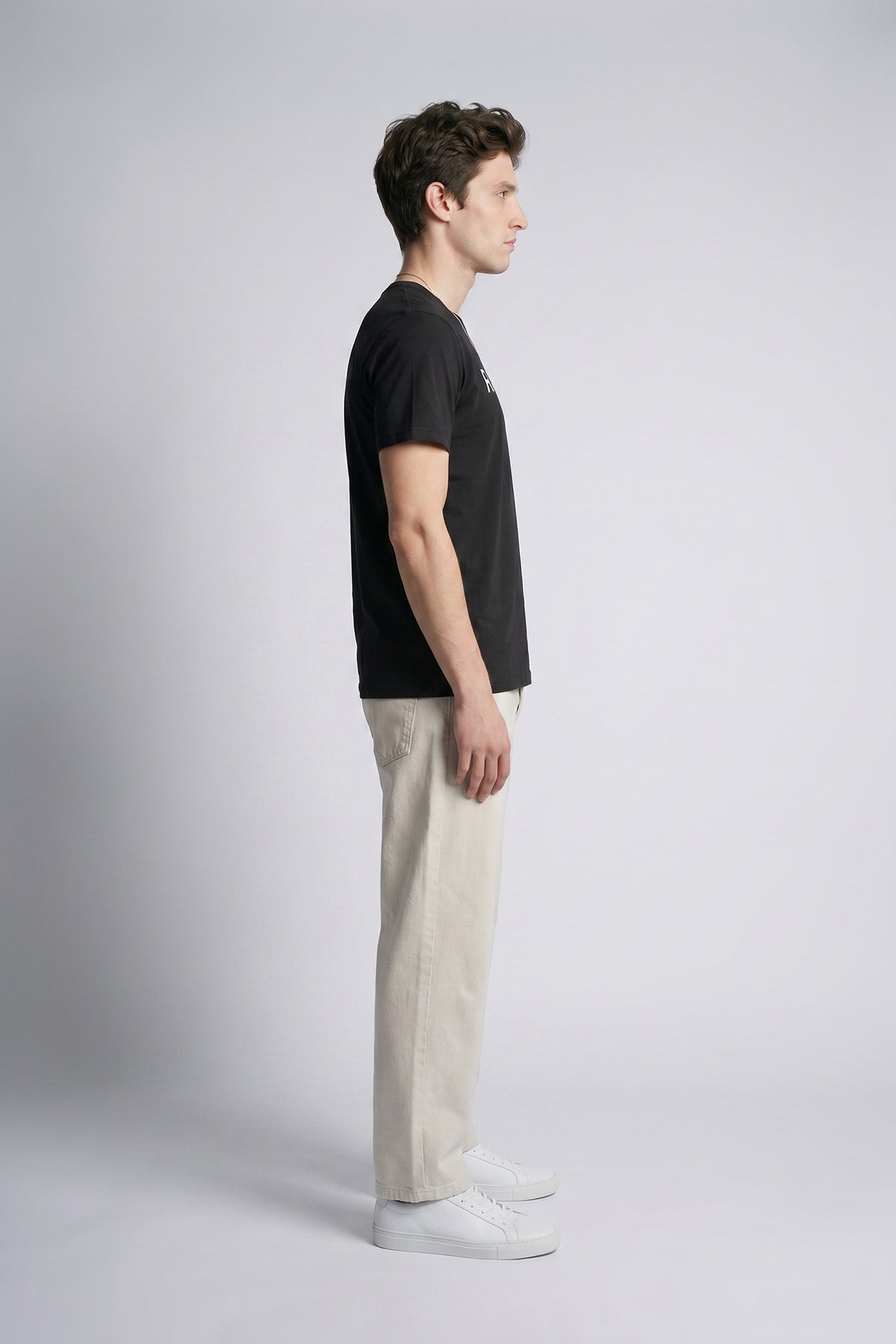 Black male model side view — RARILETO Logo Classic Tee